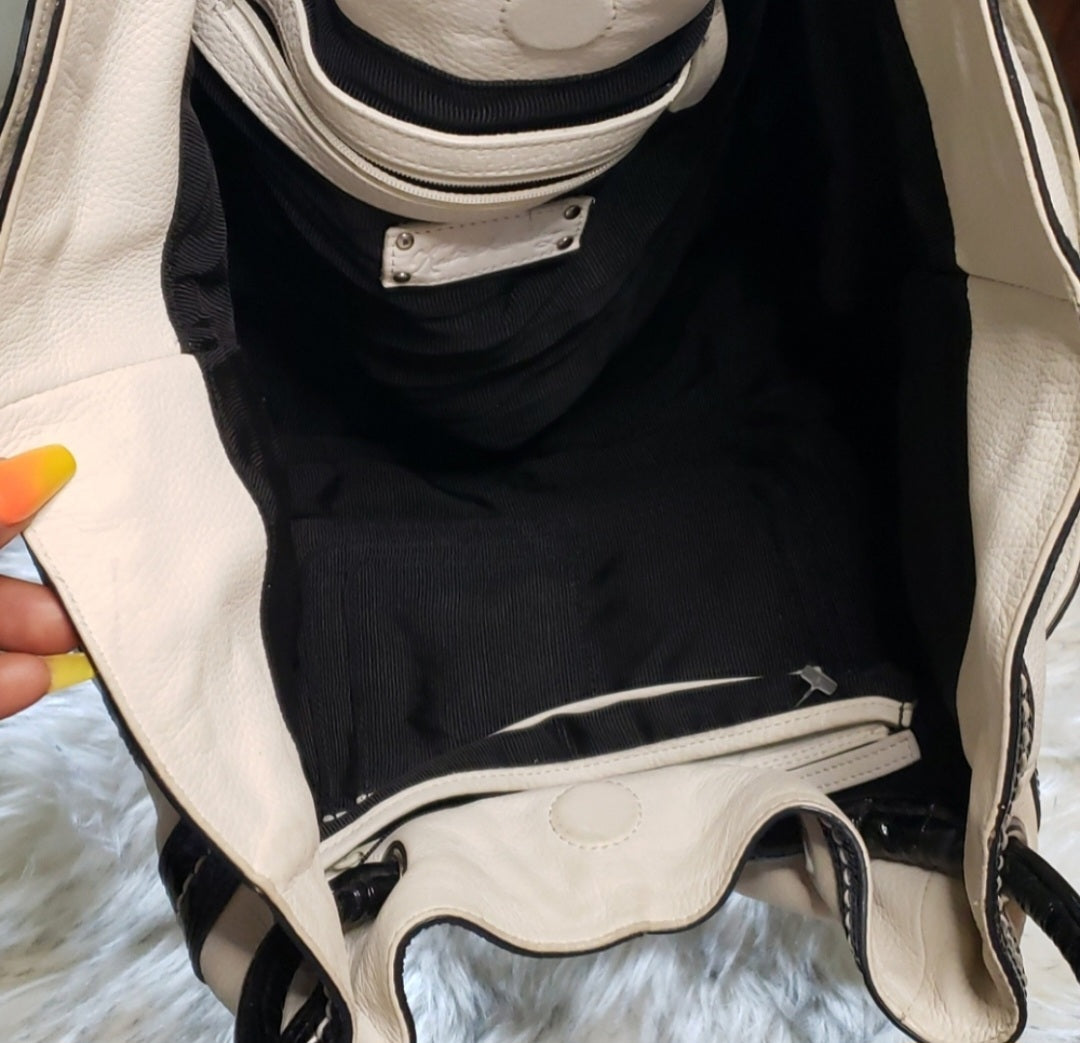 Kate Laundry black and white leather bucket bag.
