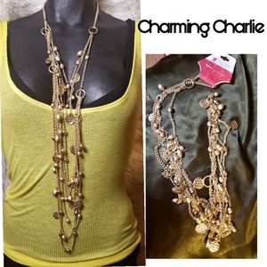 Charming Charlie multistrend charmed necklace. 35"