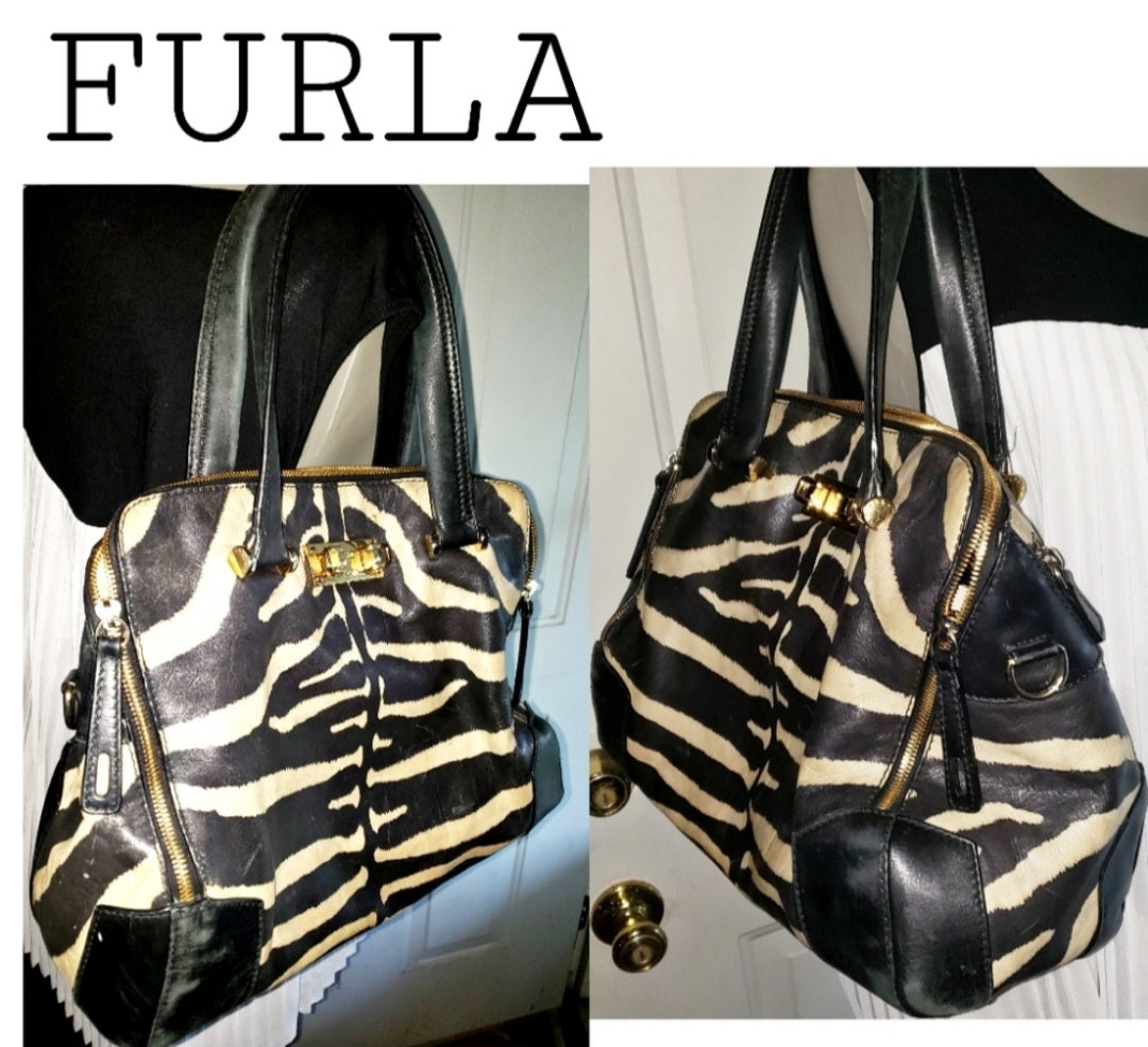 Auth FURLA zebra print piper dome leather handbag.