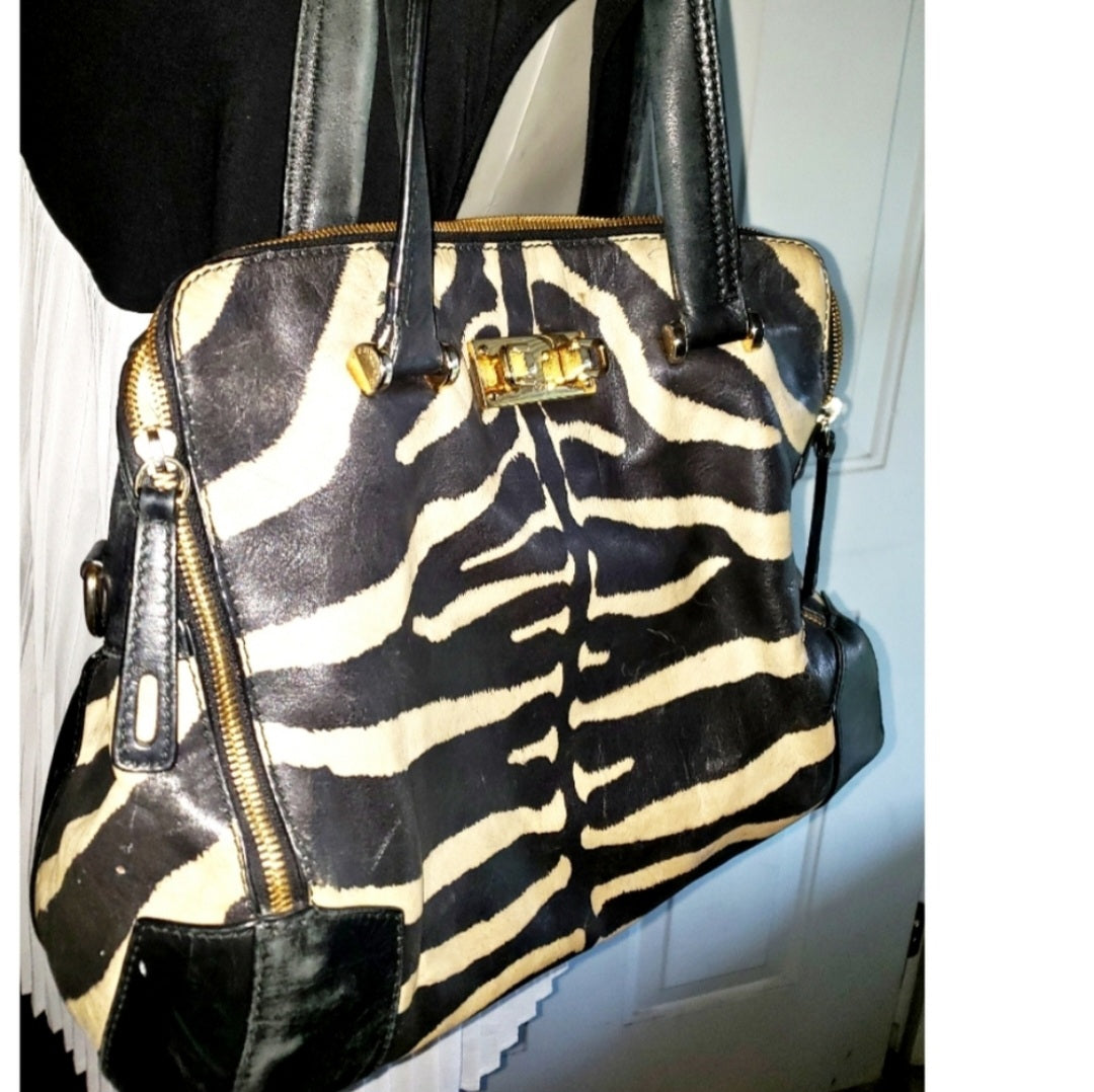 Auth FURLA zebra print piper dome leather handbag.