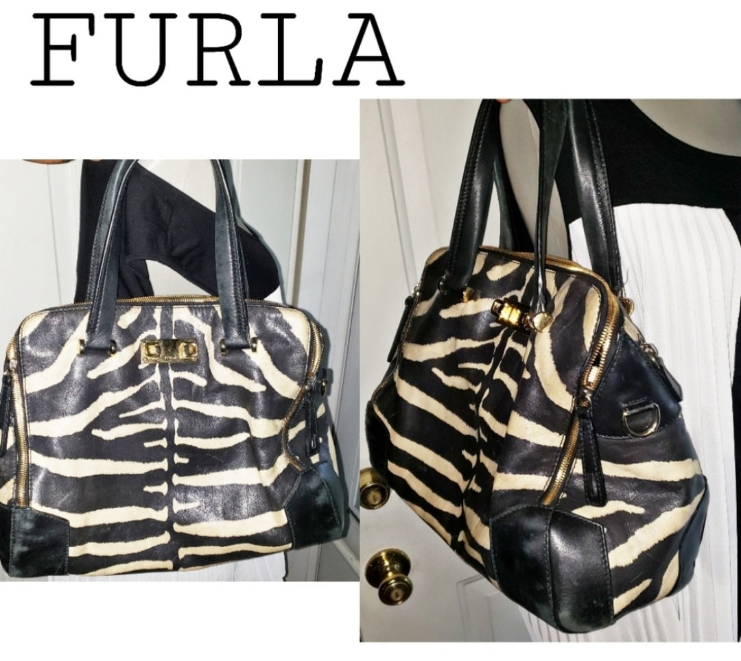 Auth FURLA zebra print piper dome leather handbag.