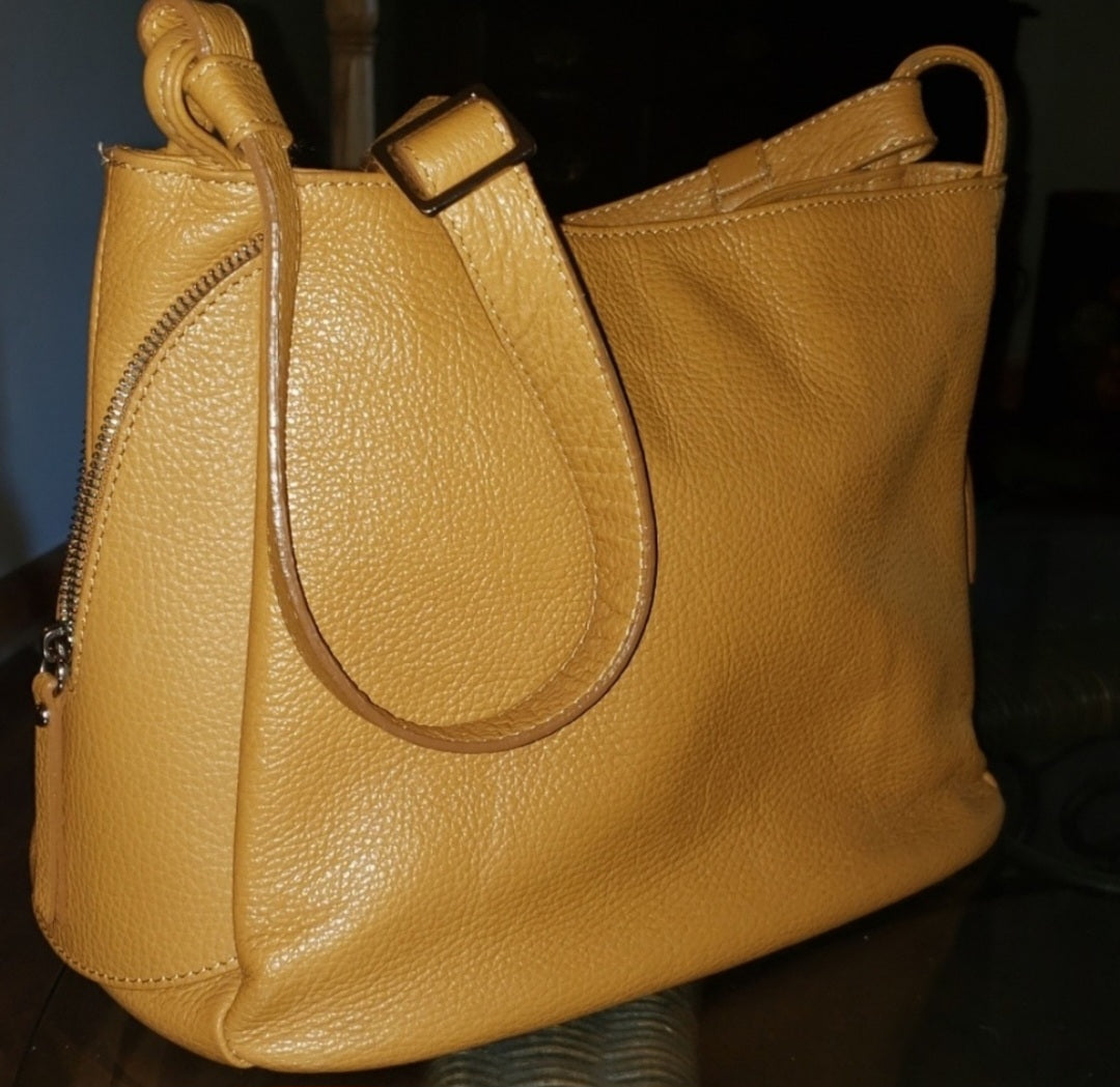 Auth Viola Castellani (Milano) saddle tan bag.