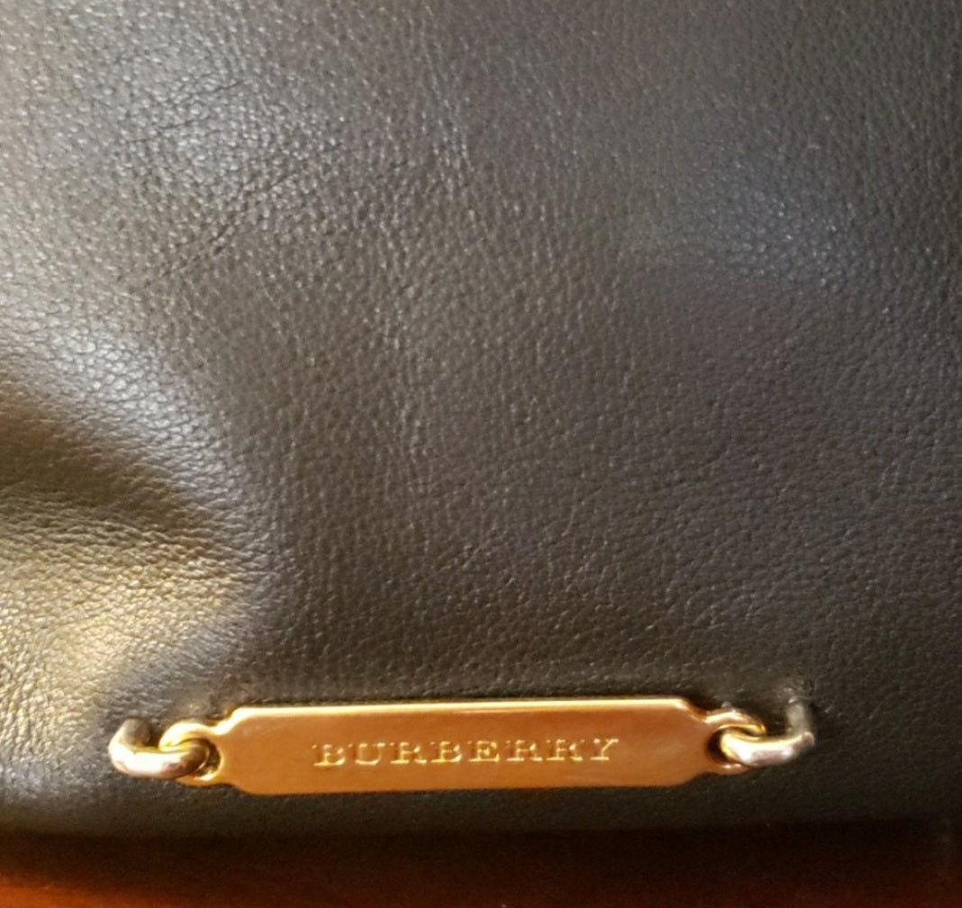 Auth Burberry black leather handbag w/traditional check