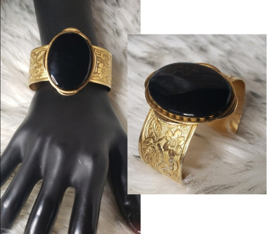 Erica Lyons gold tone onyx cuff bracelet.