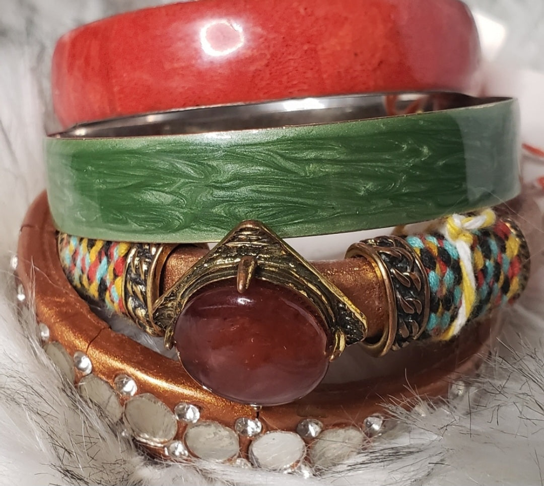 4 Set of stone and inlaid bracelets.