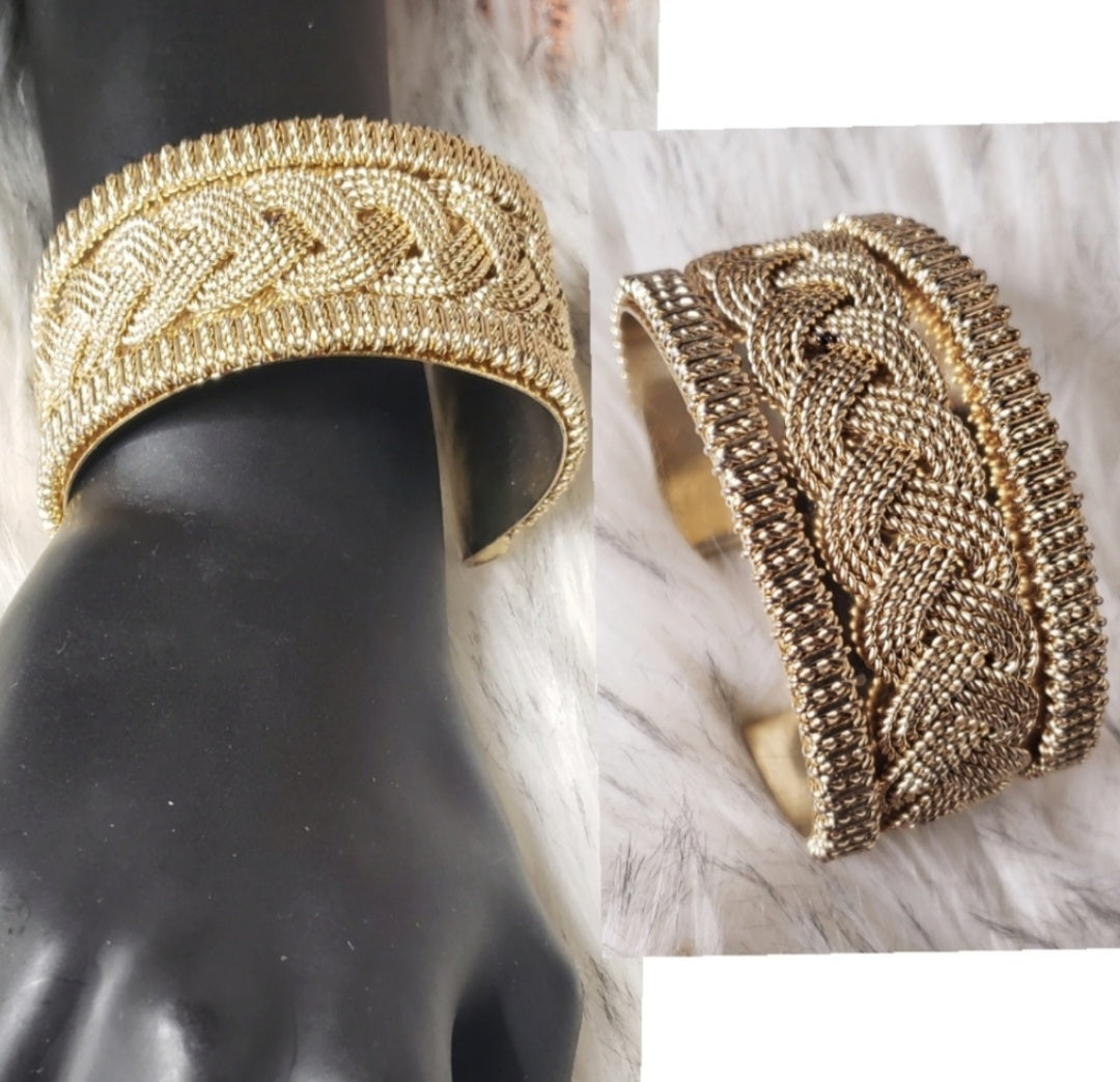 Gold-tone braided design cuff.