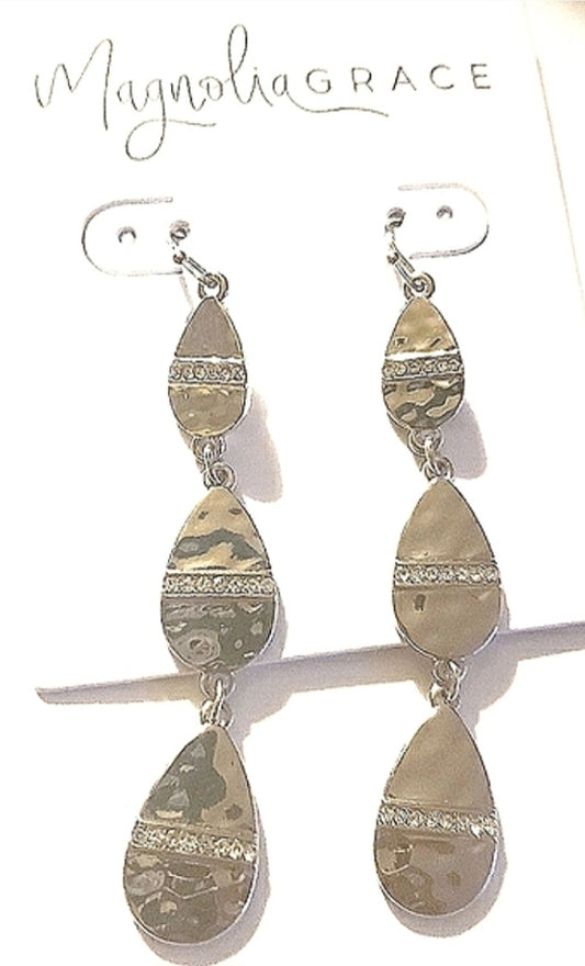 Magnolia Grace silver dangling earrings.