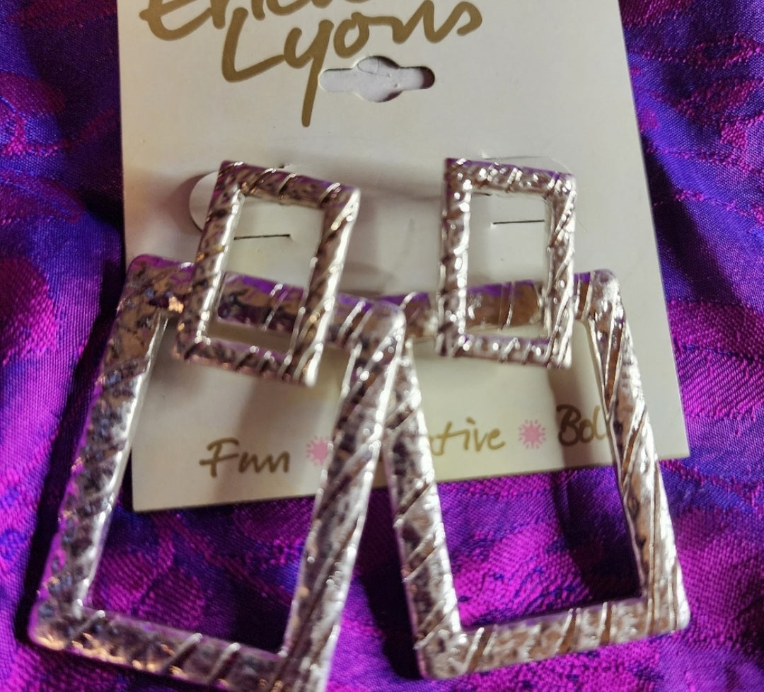 Erica Lyons rectangle diamond cut earrings. Silver. Pierced