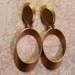 Tube dimension clip ons earrings.  Dust gold.