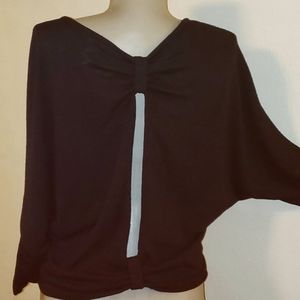 Black jersey bowed peekaboo back btwng top. Sz M