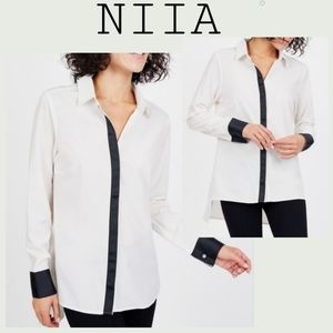 Niia

Contrast Button Down blouse. Sz Med