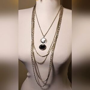 Vintage multi-chained with locket pendant.