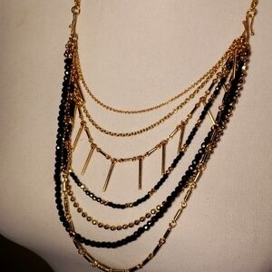 SAQ multi-strand blk/gld chain necklace.